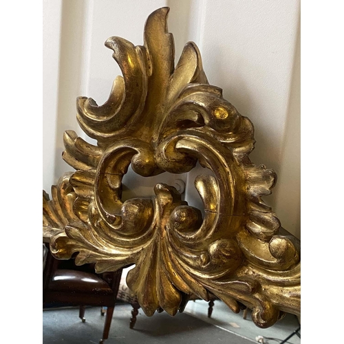 215 - OVERMANTEL MIRROR, 19th century carved giltwood with 'C' scroll crest and foliage floral frame of wa... 