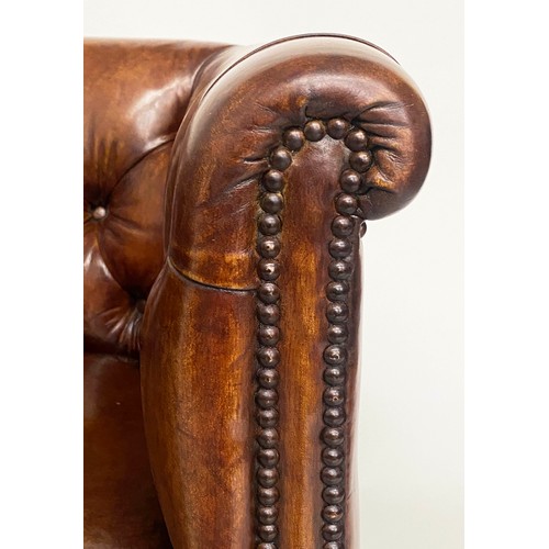 283 - DESK ARMCHAIR, Edwardian tan leather studded with rounded back and square tapering supports with cas... 