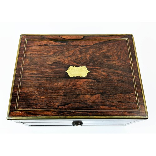 10 - SEWING BOX, Victorian, circa 1850, rosewood and brass bound, the lid enclosing a fitted silk lined i... 