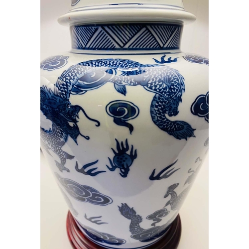 410 - TABLE LAMPS, a pair, Chinese export style blue and white ceramic with dragon design, with shades. (2... 