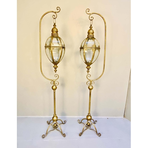 420 - LANTERNS ON STANDS, a pair, 163cm H x 35cm W x 30cm D, Regency style, gilt metal, cross sectioned ba... 