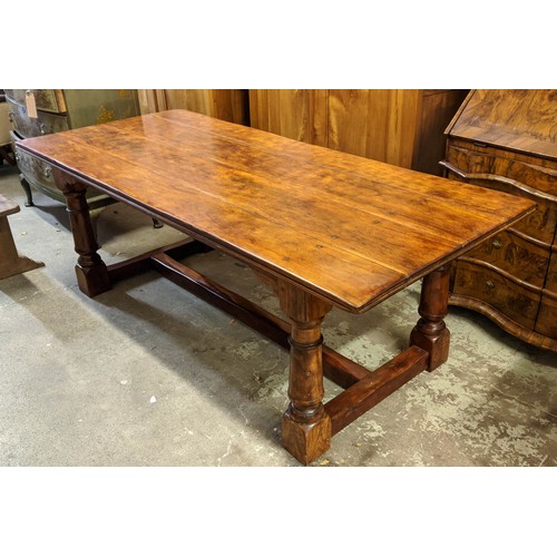 555 - FARMHOUSE DINING TABLE, walnut in the 17th century manner, 213cm L x 90cm W x 74cm H.