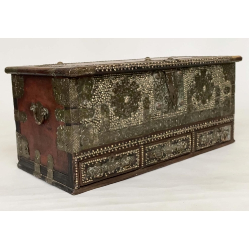 132 - ZANZIBAR TRUNK, 19th century hardwood and brass bound with rising lid and three short drawers, 110cm... 