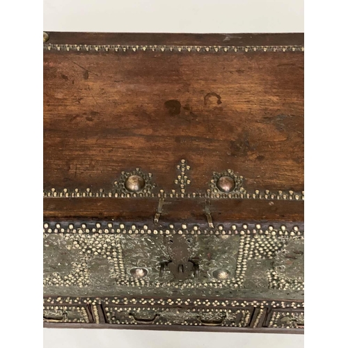 132 - ZANZIBAR TRUNK, 19th century hardwood and brass bound with rising lid and three short drawers, 110cm... 