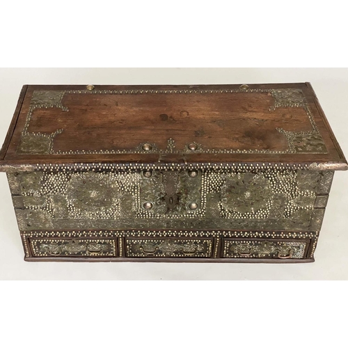 132 - ZANZIBAR TRUNK, 19th century hardwood and brass bound with rising lid and three short drawers, 110cm... 