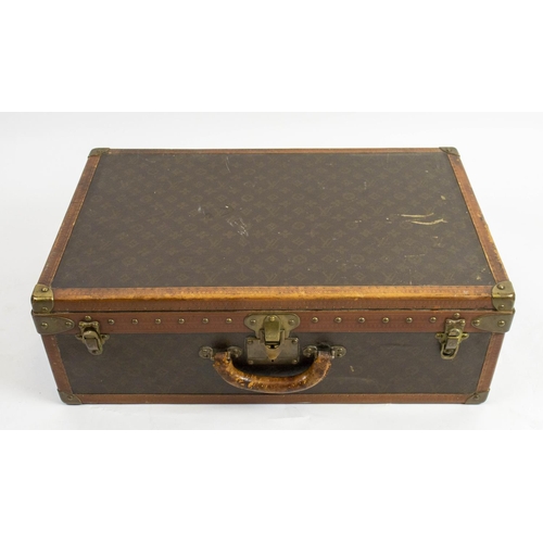 27 - LOUIS VUITTON SUITCASE, early 20th century leather trim and brass hardware with classic monogrammed ... 