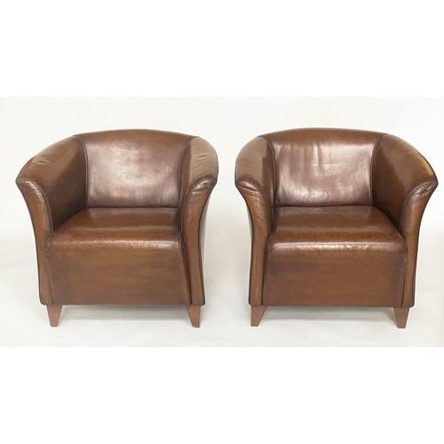 122 - ARMCHAIRS, a pair, mid brown tan leather with outswept arms and splay supports, 76cm W. (2)