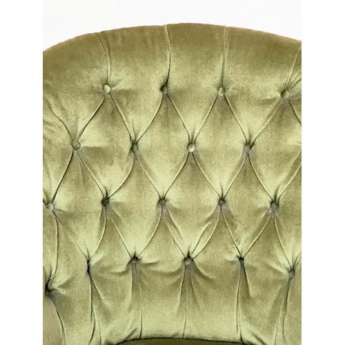 128 - ARMCHAIR, Victorian, moss green velvet upholstered with arched buttoned back and turned supports, 72... 