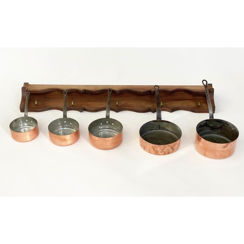 136 - BATTERIE DE CUISINE, copper pans, a set of five graduated pots with stand, largest, 26cm W. (6)