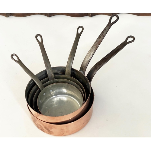 136 - BATTERIE DE CUISINE, copper pans, a set of five graduated pots with stand, largest, 26cm W. (6)