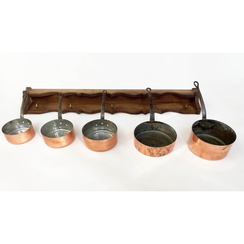 136 - BATTERIE DE CUISINE, copper pans, a set of five graduated pots with stand, largest, 26cm W. (6)