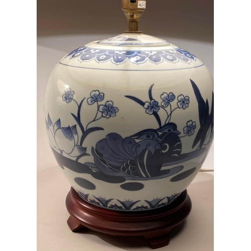 252 - TABLE LAMPS, 58cm H, a pair, Chinese blue and white ceramic of jar form with carved wooden bases and... 