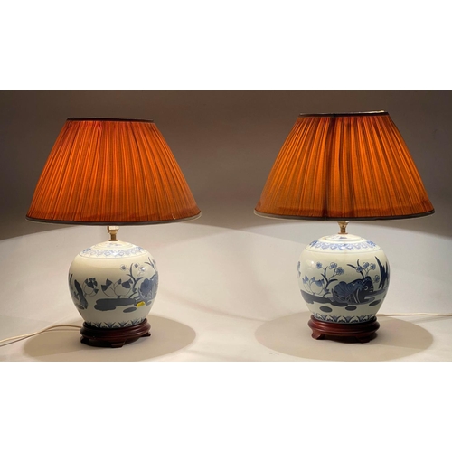 252 - TABLE LAMPS, 58cm H, a pair, Chinese blue and white ceramic of jar form with carved wooden bases and... 