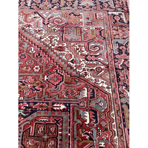 95 - ANTIQUE PERSIAN HERIZ CARPET, 405cm x 300cm.