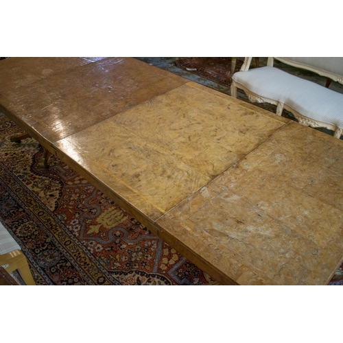 282 - DINING TABLE, Regency style, burr elm and elm with twin pedestals, two extra leaves, brass clips and... 