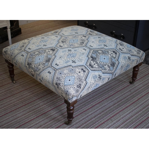 284 - HEARTH STOOL, 40cm H x 96cm x 96cm, beechwood in geometric chenille with brass castors.