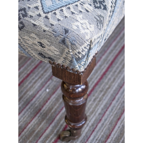284 - HEARTH STOOL, 40cm H x 96cm x 96cm, beechwood in geometric chenille with brass castors.
