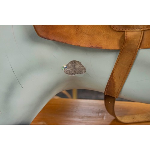 277 - ROCKING HORSE, 129cm H x 180cm L x 56cm W, painted fibreglass with leather saddle on wood stand.