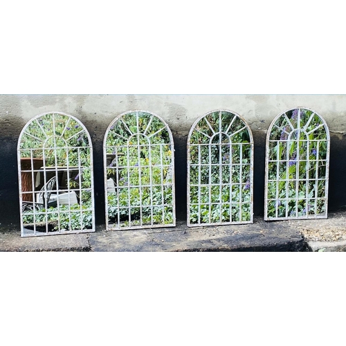 476 - ARCHITECTURAL GARDEN WALL MIRRORS, a set of four, aged metal arched frames, 60cm x 36cm. (4)