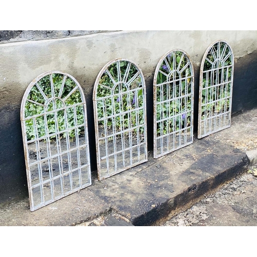 476 - ARCHITECTURAL GARDEN WALL MIRRORS, a set of four, aged metal arched frames, 60cm x 36cm. (4)