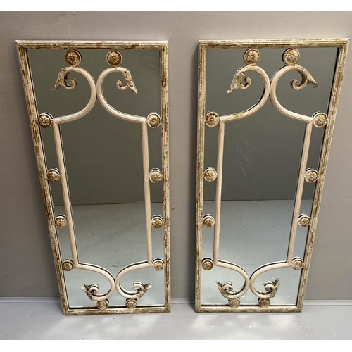 479 - ARCHITECTURAL WALL MIRRORS, a pair, Regency style, aged metal frames, 112cm x 48cm. (2)