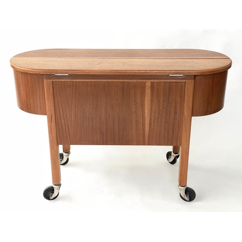 298 - COCKTAIL TROLLEY, 1950s mahogany oval opening foldout filled, rising interior with castors, 115cm W ... 