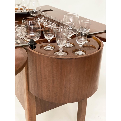 298 - COCKTAIL TROLLEY, 1950s mahogany oval opening foldout filled, rising interior with castors, 115cm W ... 