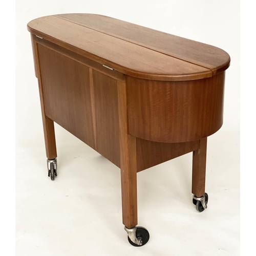 298 - COCKTAIL TROLLEY, 1950s mahogany oval opening foldout filled, rising interior with castors, 115cm W ... 
