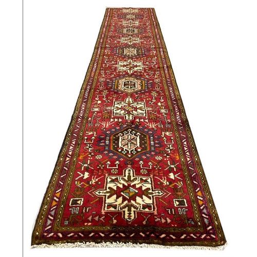 93 - PERSIAN HERIZ RUNNER, 390cm x 77cm.