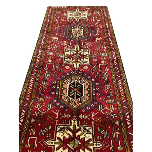 93 - PERSIAN HERIZ RUNNER, 390cm x 77cm.