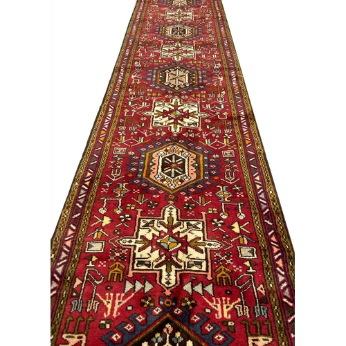 93 - PERSIAN HERIZ RUNNER, 390cm x 77cm.