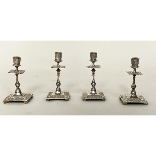 119 - CANDLESTICKS, a set of four, silvered, probably early 20th century with column and square bases, 19c... 