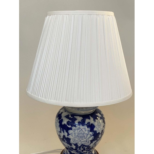 135 - TABLE LAMPS, a pair, Chinese blue and white ceramic of vase form with carved wooden bases and shades... 