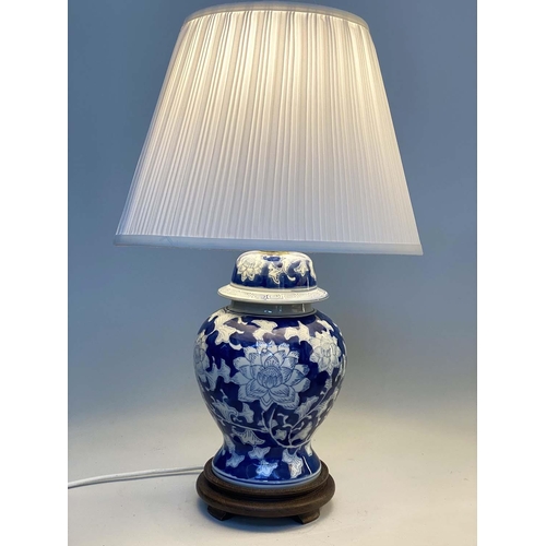 135 - TABLE LAMPS, a pair, Chinese blue and white ceramic of vase form with carved wooden bases and shades... 