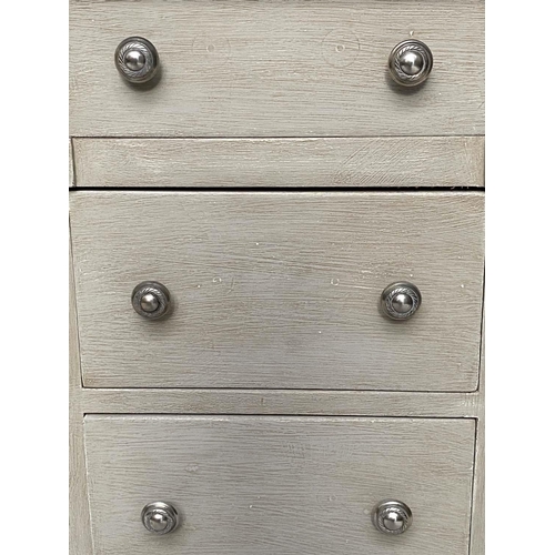 120 - BEDSIDE CHESTS, a pair, Gustavian style grey painted and silvered metal mounted each with three draw... 