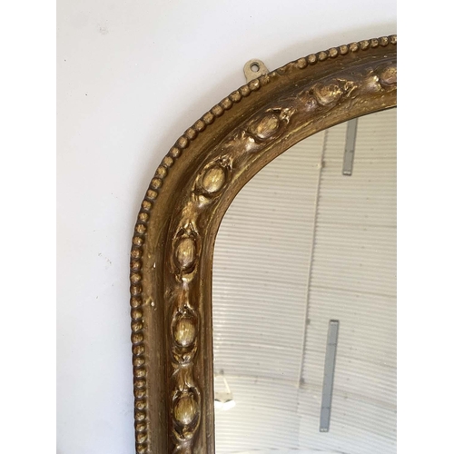 138 - OVERMANTEL MIRROR, Victorian giltwood and gesso moulded of arched outline with beaded and moulded fr... 