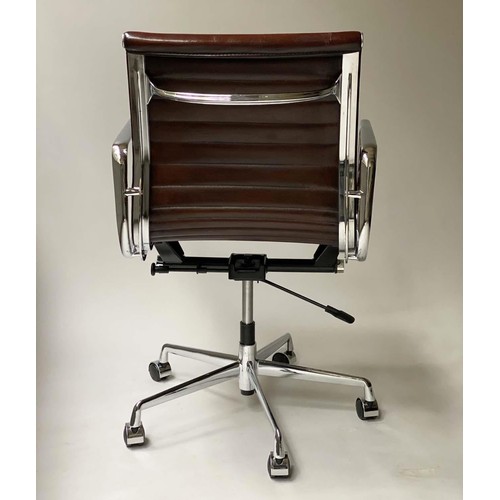 112 - REVOLVING DESK CHAIR, Charles and Ray Eames inspired with ribbed mid brown leather seat revolving an... 