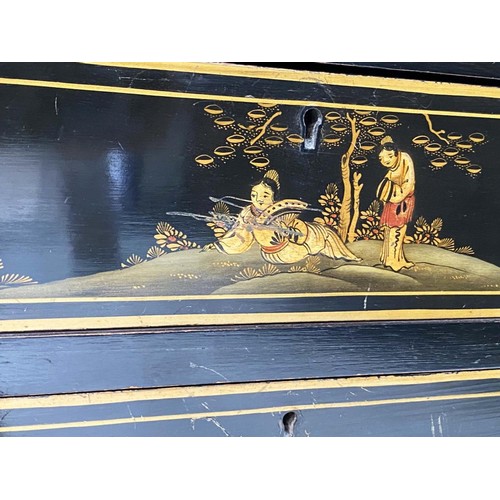 196 - BUREAU, 1930s black lacquered and gilt Chinoiserie decorated with fitted interior and three long dra... 