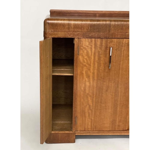 242 - ART DECO DRINKS CABINET, oak with rounded top and pair of doors enclosing fitted interior and drawer... 