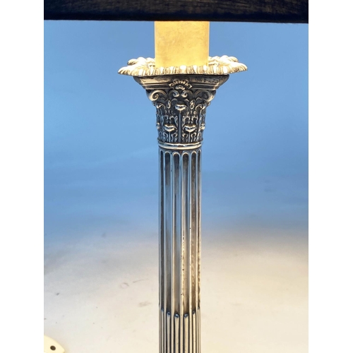 243 - SILVER TABLE LAMPS, a pair early 20th century silver with Corinthian capped reeded columns stamped a... 