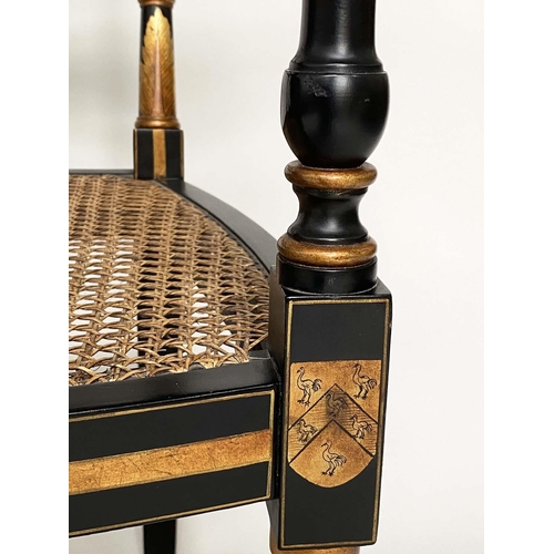 247 - ARMCHAIRS, a pair, Regency style lacquered and gilded each with cane seat and 'X' back, 56cm W. (2)