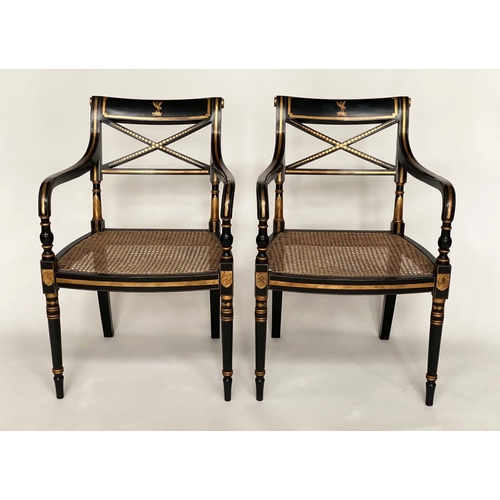 247 - ARMCHAIRS, a pair, Regency style lacquered and gilded each with cane seat and 'X' back, 56cm W. (2)