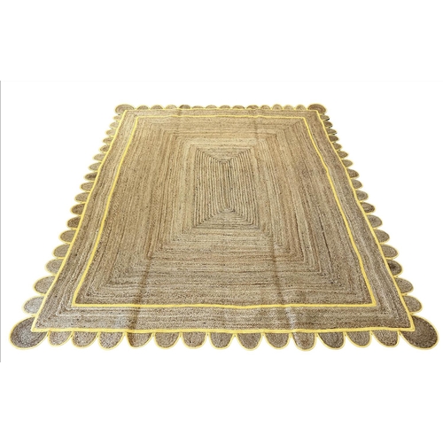 121 - SCALLOPED EDGE JUTE RUG, 315cm x 247cm.