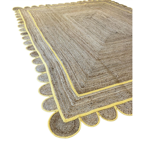 121 - SCALLOPED EDGE JUTE RUG, 315cm x 247cm.