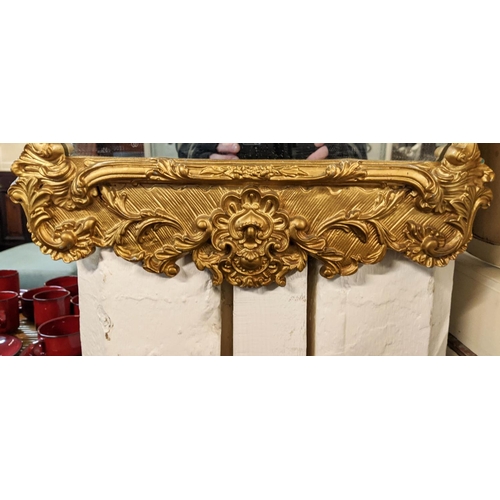 286 - GILT METAL WALL MIRROR, baroque style, 99cm H x 45cm W.