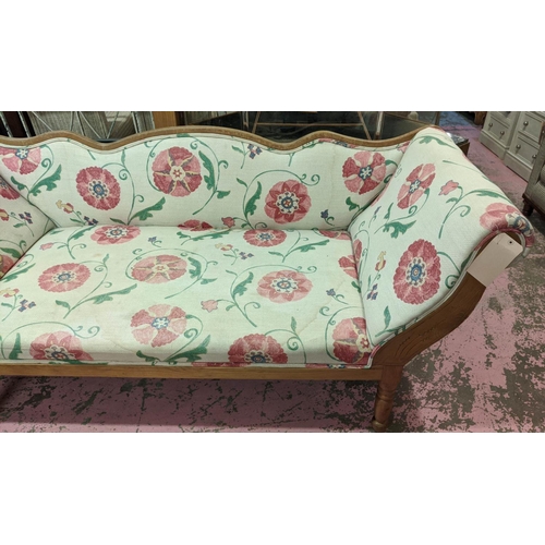 297 - SETTEE, late 19th century Continental ash in Colefax & Fowler style upholstery, raised on turned leg... 