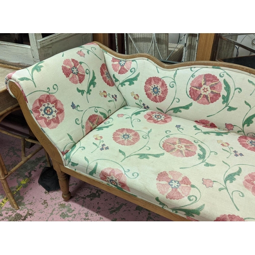 297 - SETTEE, late 19th century Continental ash in Colefax & Fowler style upholstery, raised on turned leg... 