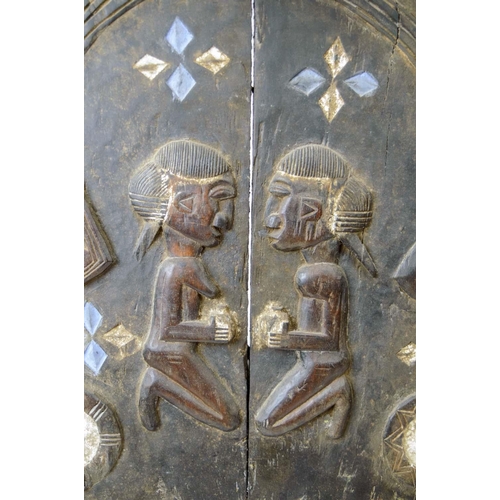 3 - AFRICAN TRIBAL DOOR, carved with opposing kneeling figures with feather edge and blue and white deta... 