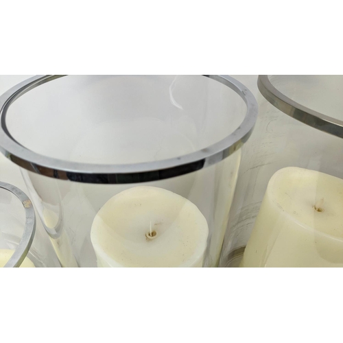 312 - RALPH LAUREN HOME HURRICANE LANTERNS, a set of four, with faux candles, 45.5cm H at largest. (4)