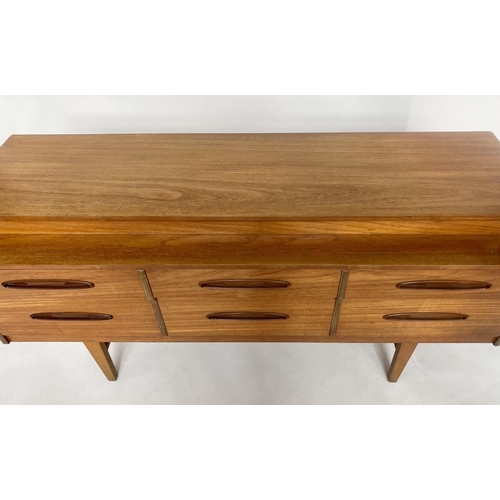 342 - LOW CHEST, 1970s teak with six short drawers and tapering supports, 150cm W x 50cm D x 70cm H.